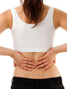 Woman With her hands on her back